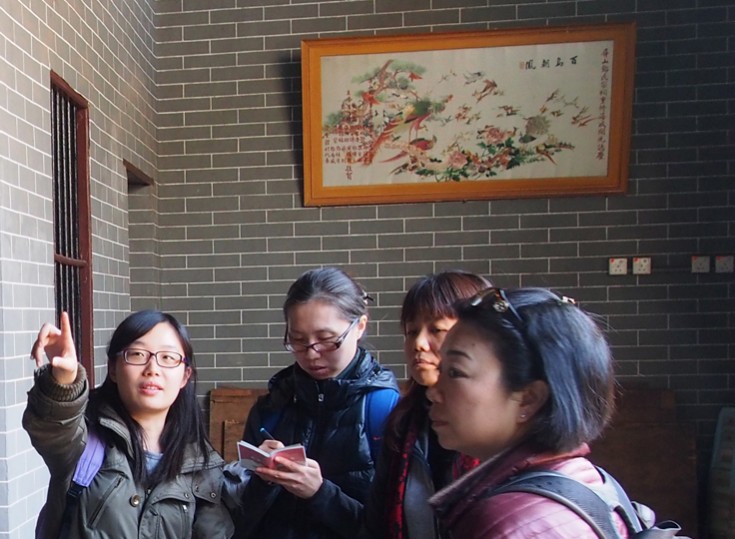 Ling, one of our tutors, explains the auspicious motifs engraved on the lintels and brackets inside the Tang Ancestral Hall.